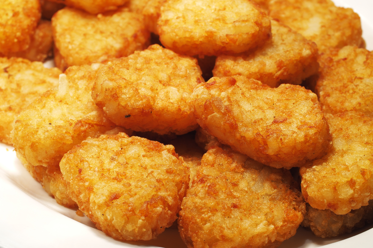 Frozen shredded potatoes formed into hash browns for easy preparation.