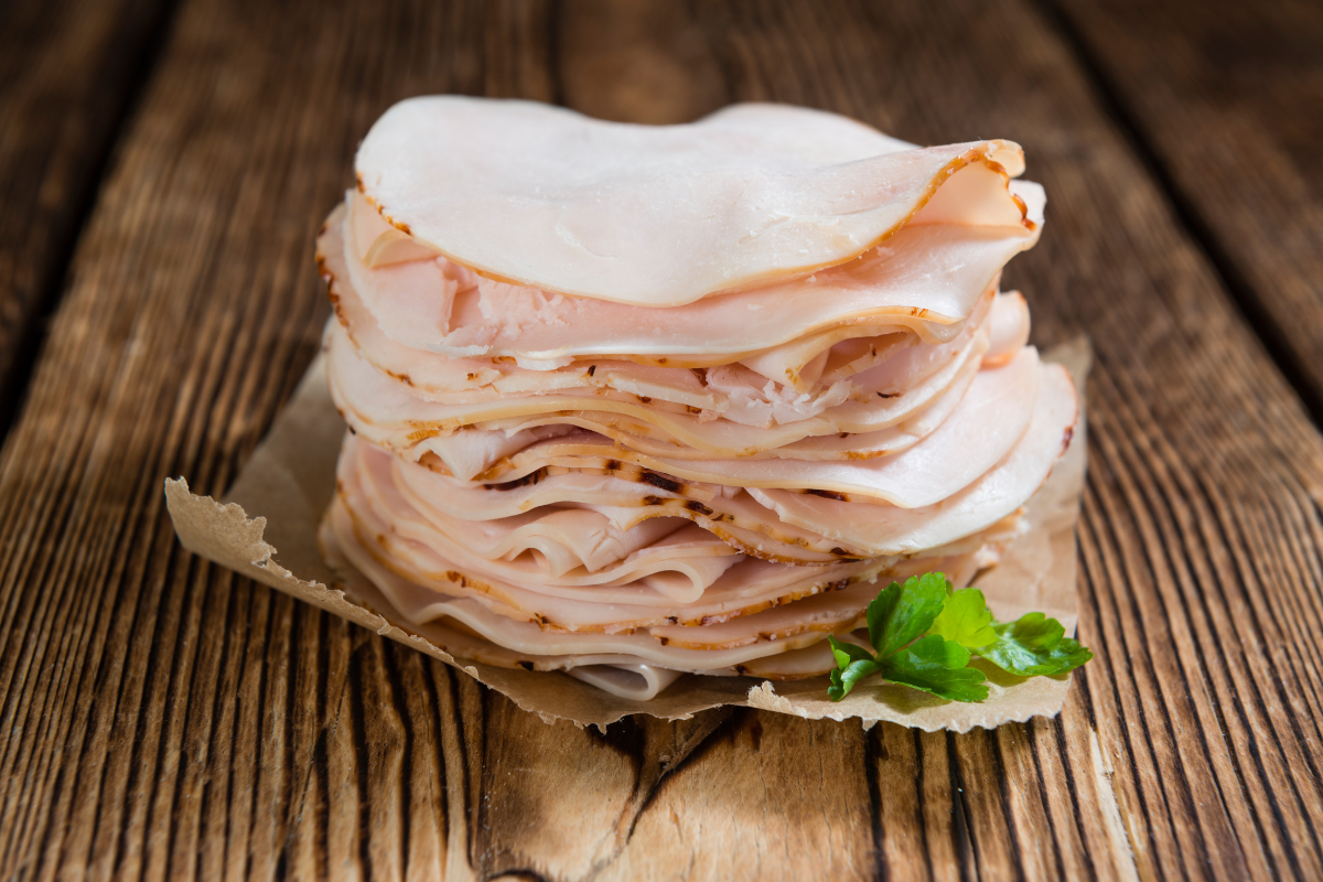 Sautéed thin sliced chicken breast paired with vibrant vegetables for a nutritious and flavorful dish.