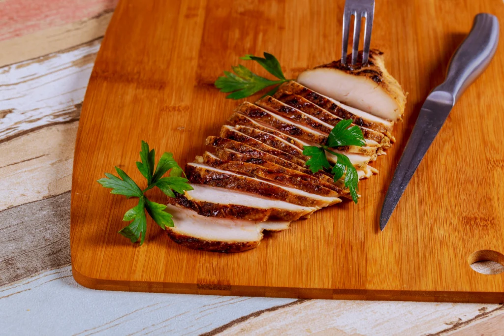 Delicious thin sliced chicken breast seasoned and cooked to perfection, ready to be served in a healthy meal.