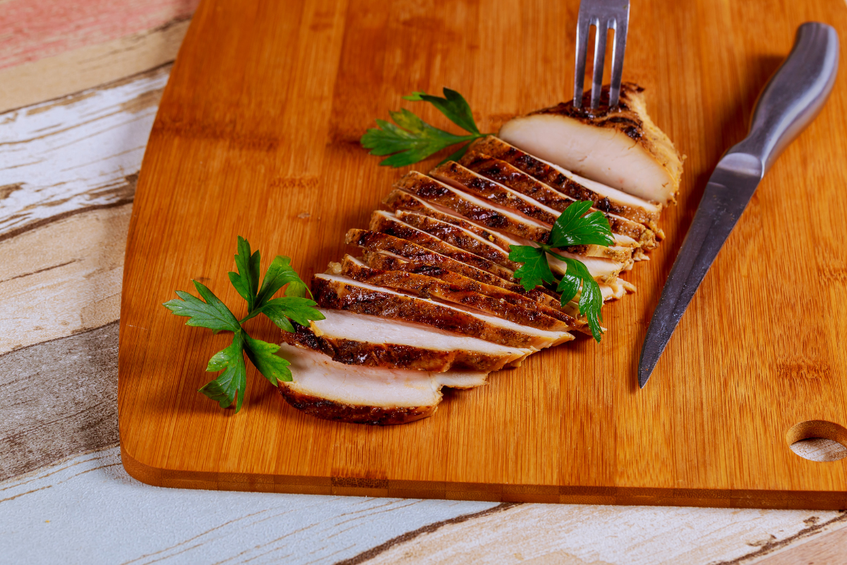 Delicious thin sliced chicken breast seasoned and cooked to perfection, ready to be served in a healthy meal.